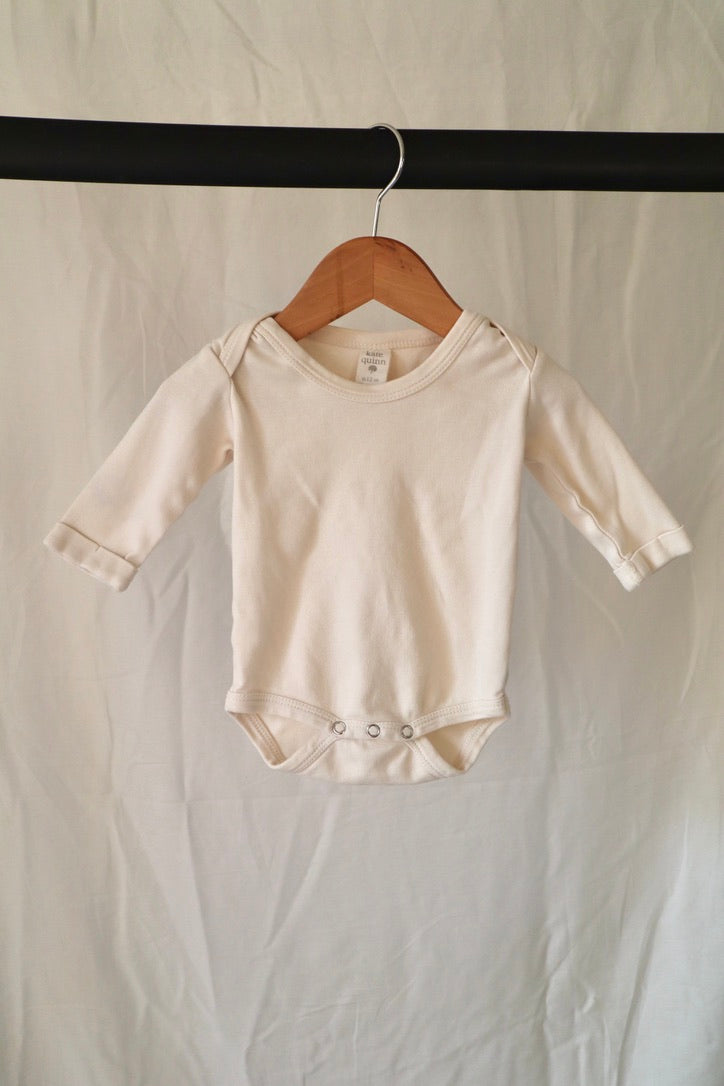 Kate Quinn Organic Cotton Long Sleeve Bodysuit — Ivory — 6–12M