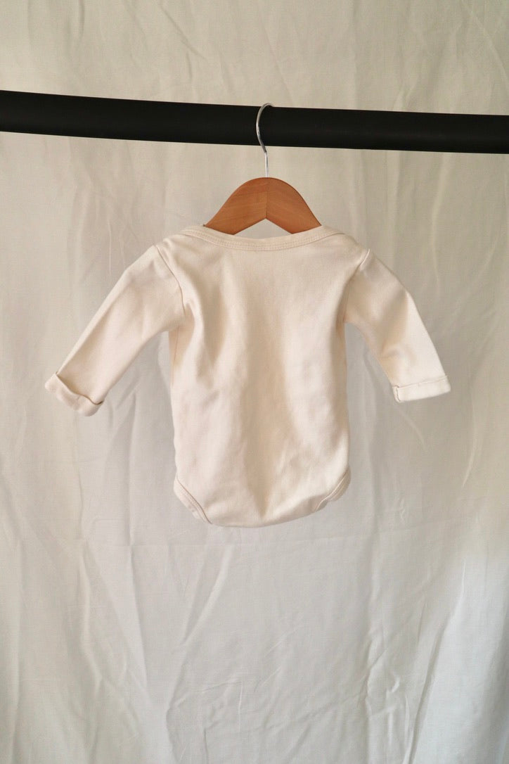 Kate Quinn Organic Cotton Long Sleeve Bodysuit — Ivory — 6–12M