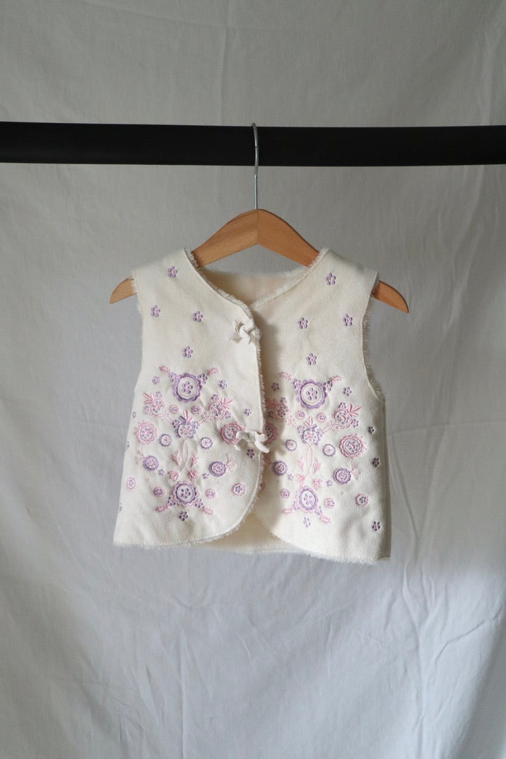 Mothercare embroidered sherpa vest in cream with lavender floral embroidery, size 12-18M